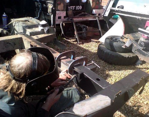 Maurice welding the new rear quarter-chassis onto Red