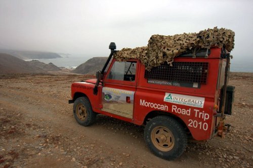 Red driving across the Sahara on a previous rally