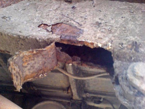 A Coke can flattened and glued to Red's chassis as a crude repair