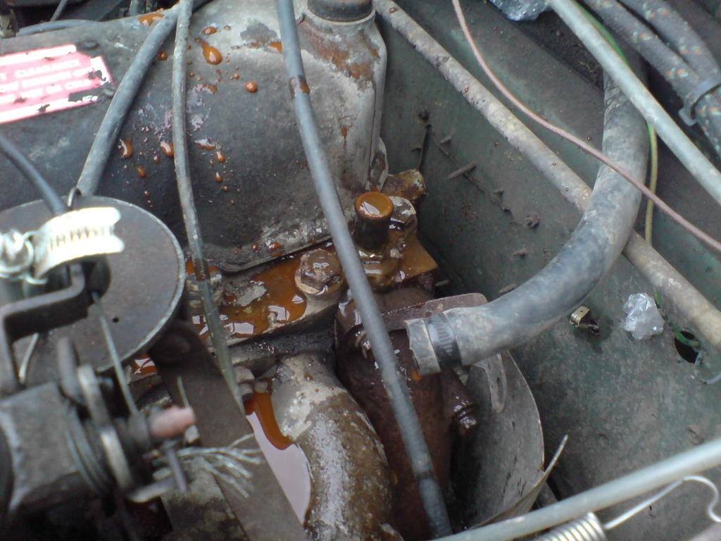 The passenger footwell of Red, with rust and a bodged repair patch removed